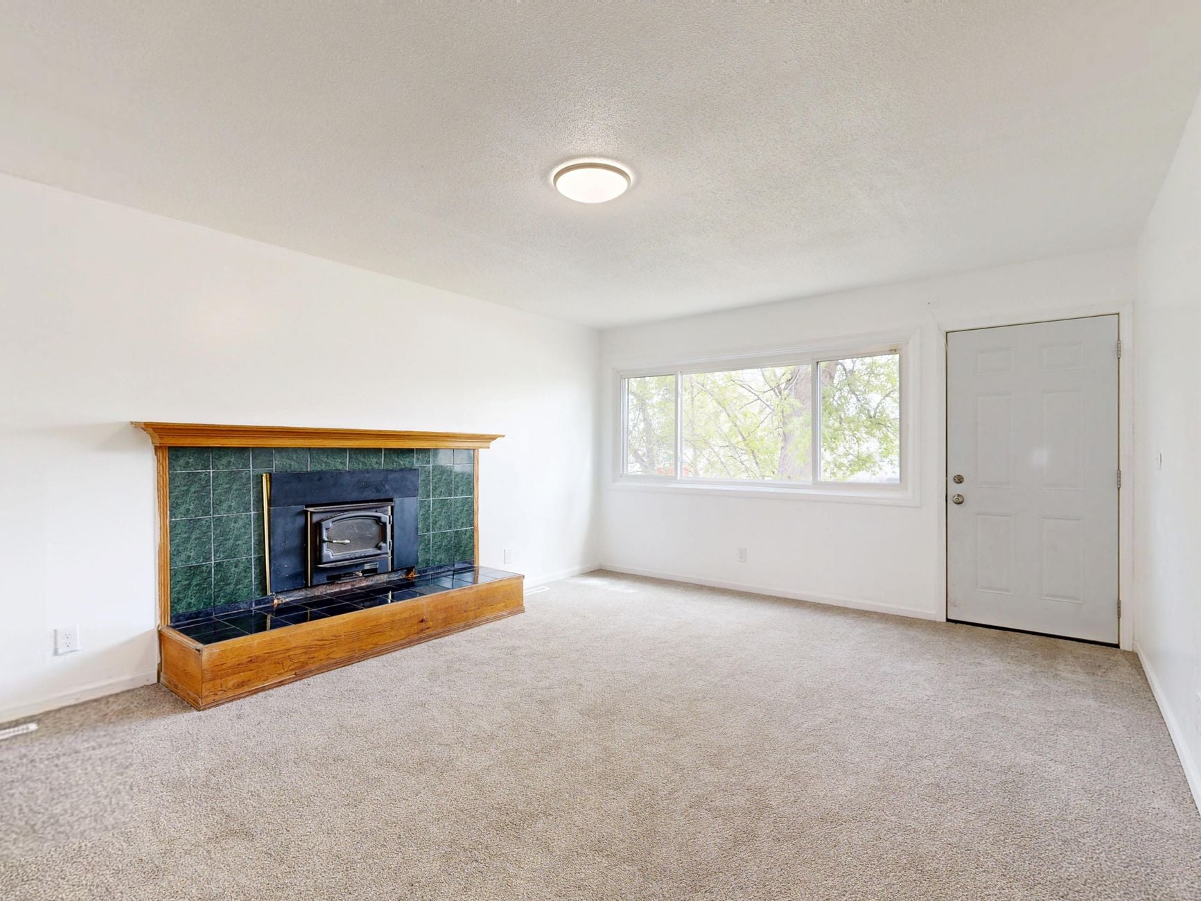 A warm fireplace with a stack of firewood evokes comfort and relaxation.